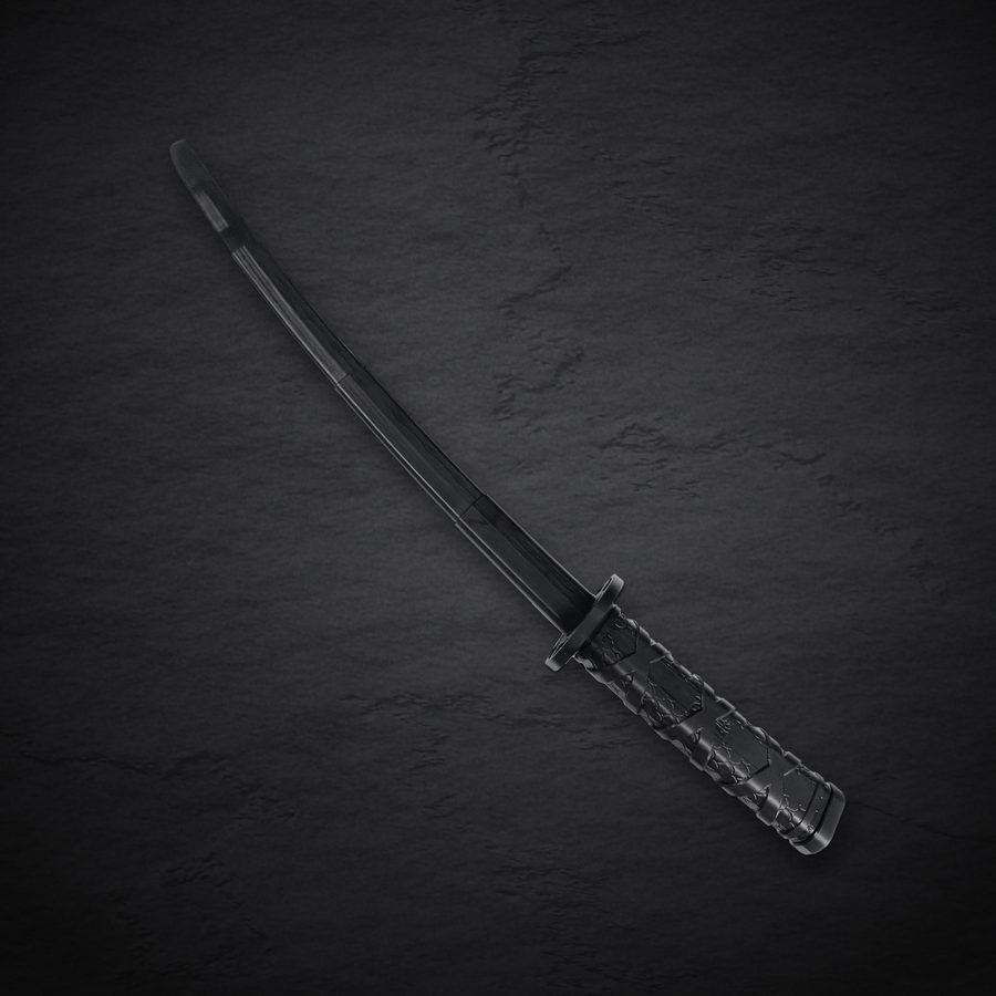 The Fukutsu fully extended, lying diagonally on dark slate